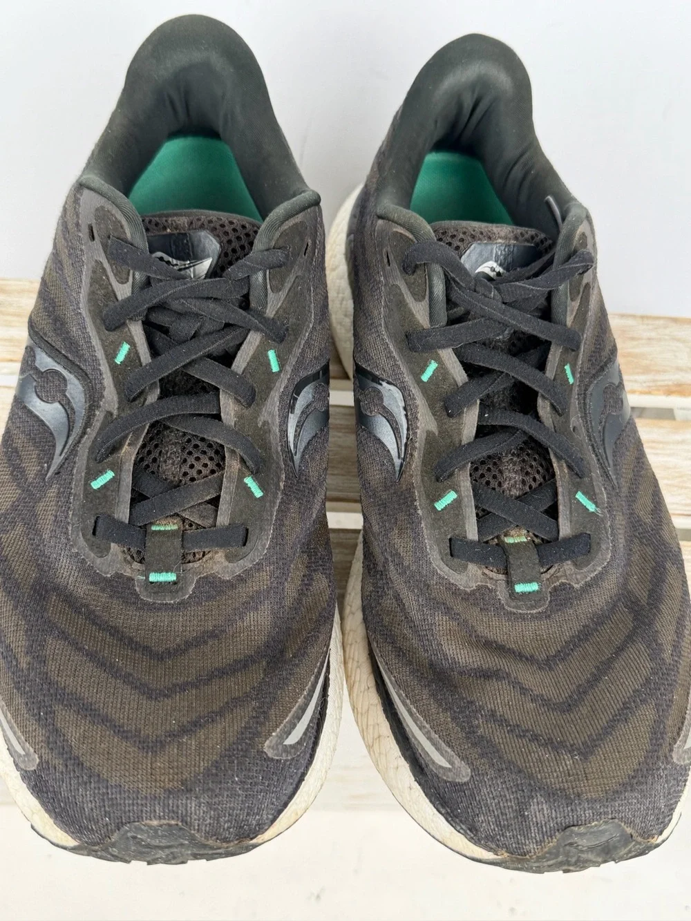 Saucony Triumph 19 running shoes in black an white with subtle teal accents 10.5